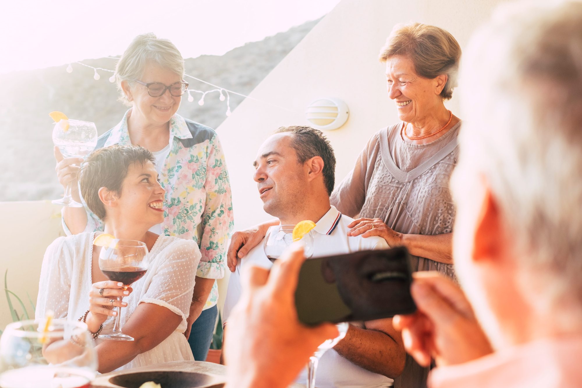 Small group of family and friends taking a celebration photograph