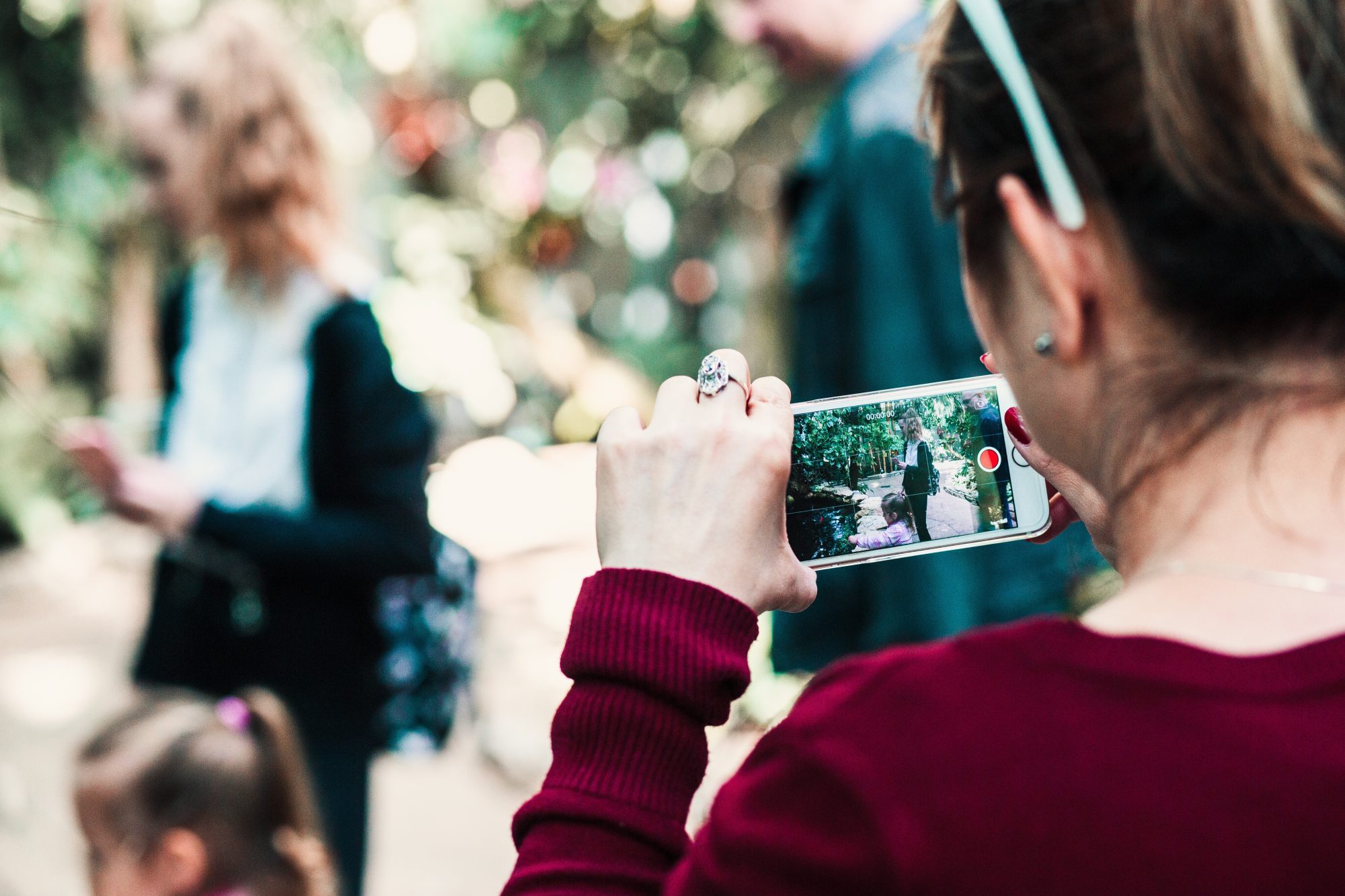 Guest recording a short family video on a mobile phone